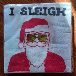 New package of beverage napkins " I SLEIGH " with Santa in gold aviators